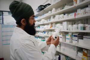 Pharmacist checking dispensary medication stock